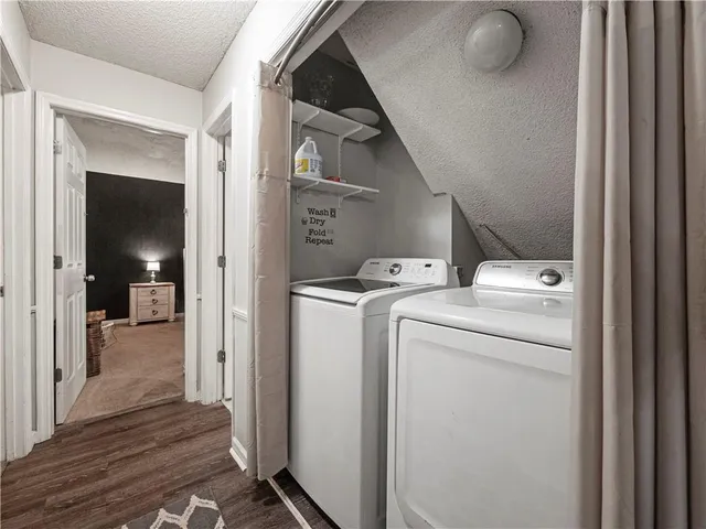 a view of storage and utility room with a washer and dryer
