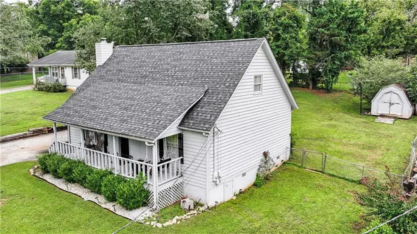 a aerial view of a house with a yard