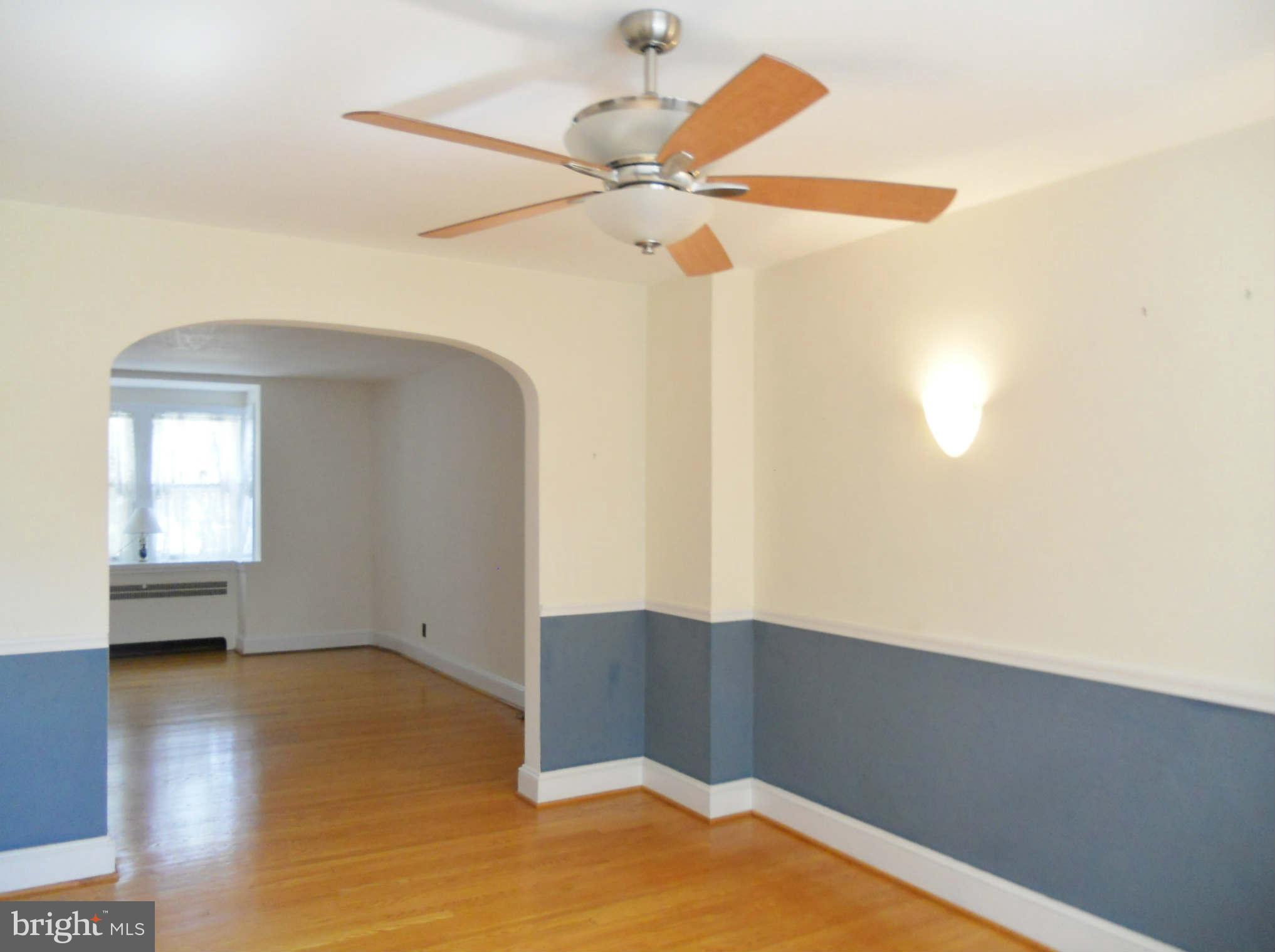 313 Murdock Road Baltimore, MD 21212 - Photo 5 of 15 a view of empty room with wooden floor