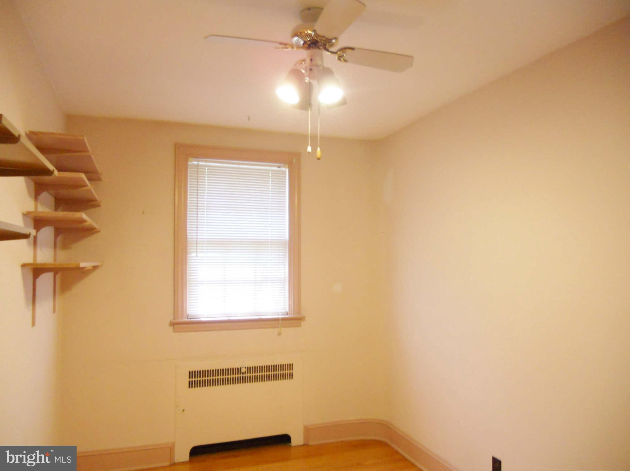 313 Murdock Road Baltimore, MD 21212 - Photo 9 of 15 a room with a window and ceiling fan