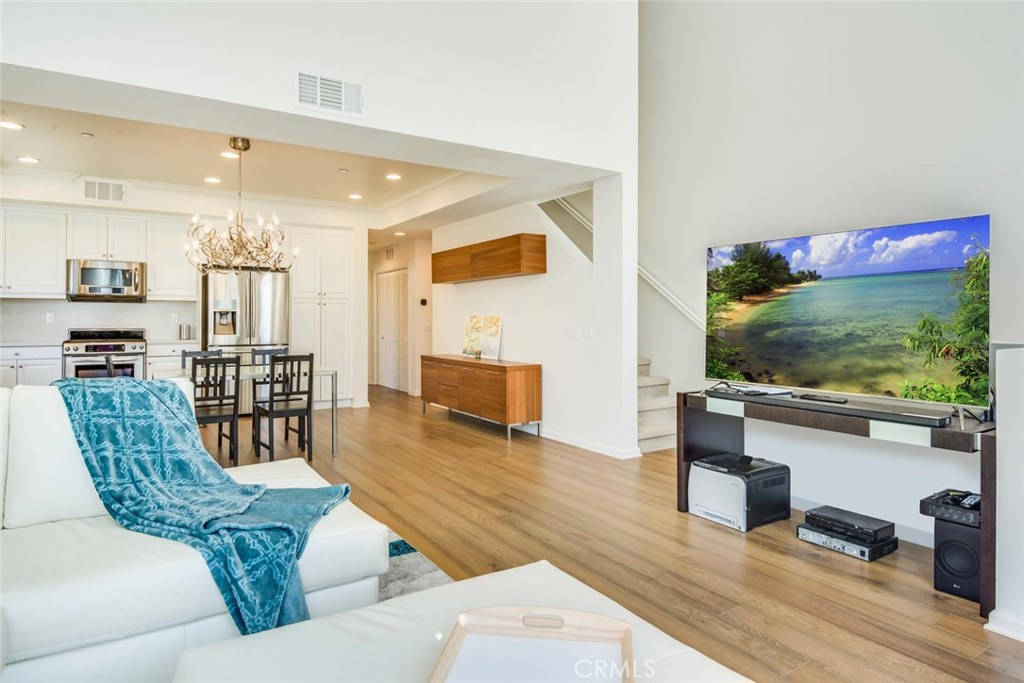 5439 Strand, Unit 101 Hawthorne, CA 90250 - Photo 1 of 23 a living room with furniture and a flat screen tv