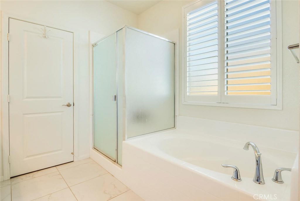5439 Strand, Unit 101 Hawthorne, CA 90250 - Photo 11 of 23 a bathroom with a bathtub and a shower