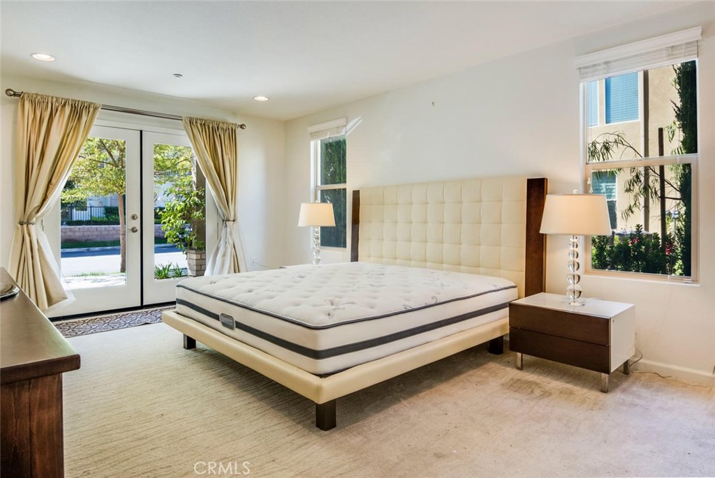 5439 Strand, Unit 101 Hawthorne, CA 90250 - Photo 15 of 23 a bed sitting in a spacious bedroom next to a window