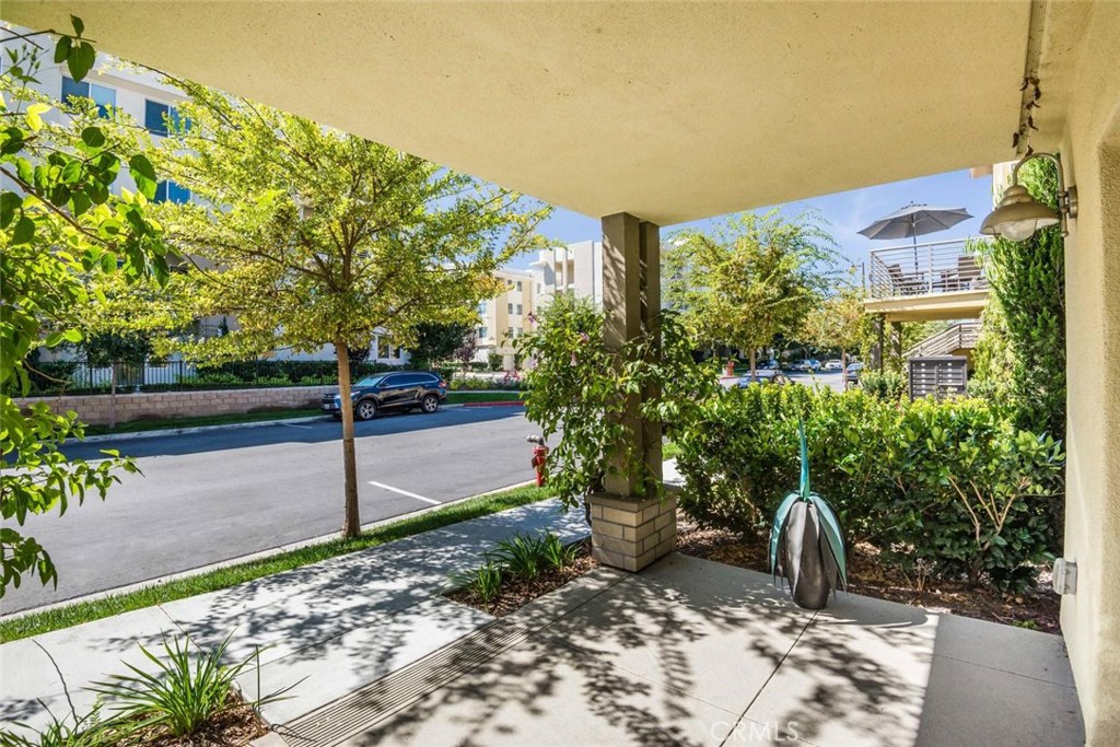 5439 Strand, Unit 101 Hawthorne, CA 90250 - Photo 19 of 23 a view of a backyard with plants and a bench
