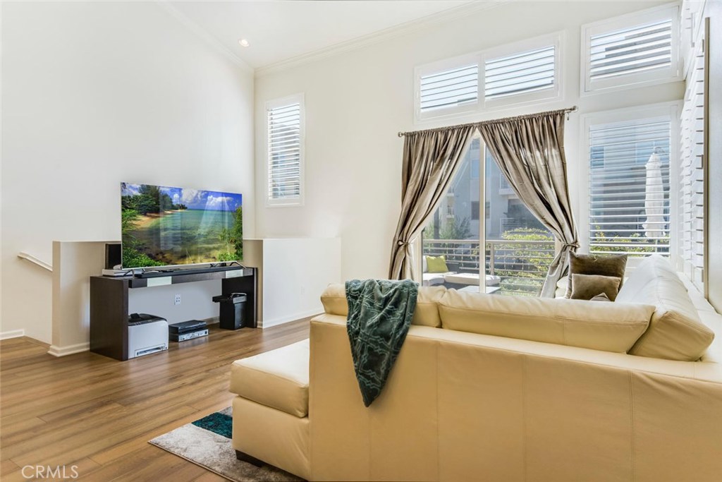 5439 Strand, Unit 101 Hawthorne, CA 90250 - Photo 2 of 23 a living room with furniture and a table
