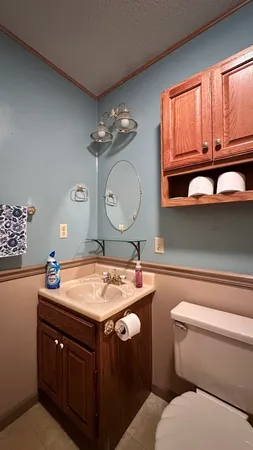 a room with a sink a stove and cabinets