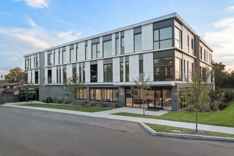 a view of a building with a street