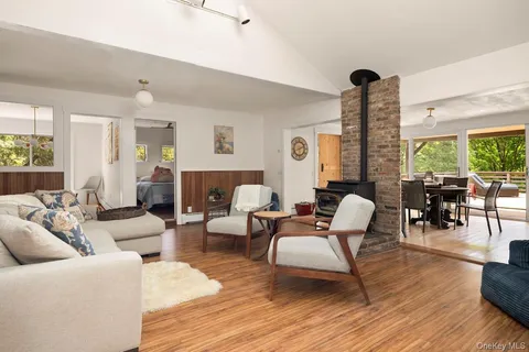 a living room with furniture and large windows