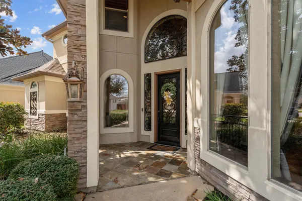 a view of entryway and hall with a front door