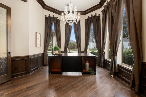 a view of cabinets with wooden floor and window