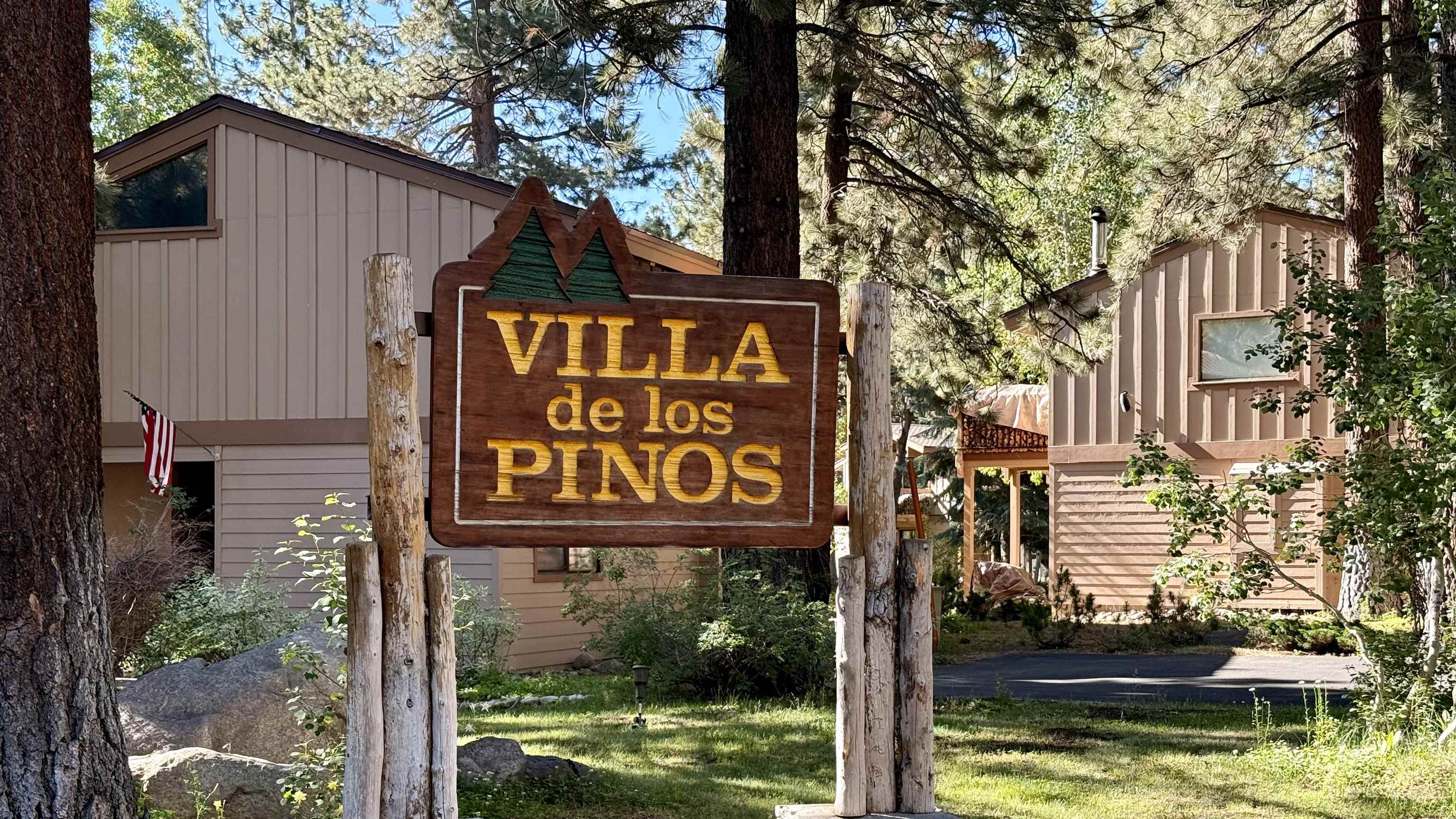 3252 Chateau Road, Unit 22 Mammoth Lakes, CA 93546 - Photo 45 of 46 Wood-carved entry sign with dimensional lettering on rustic log posts