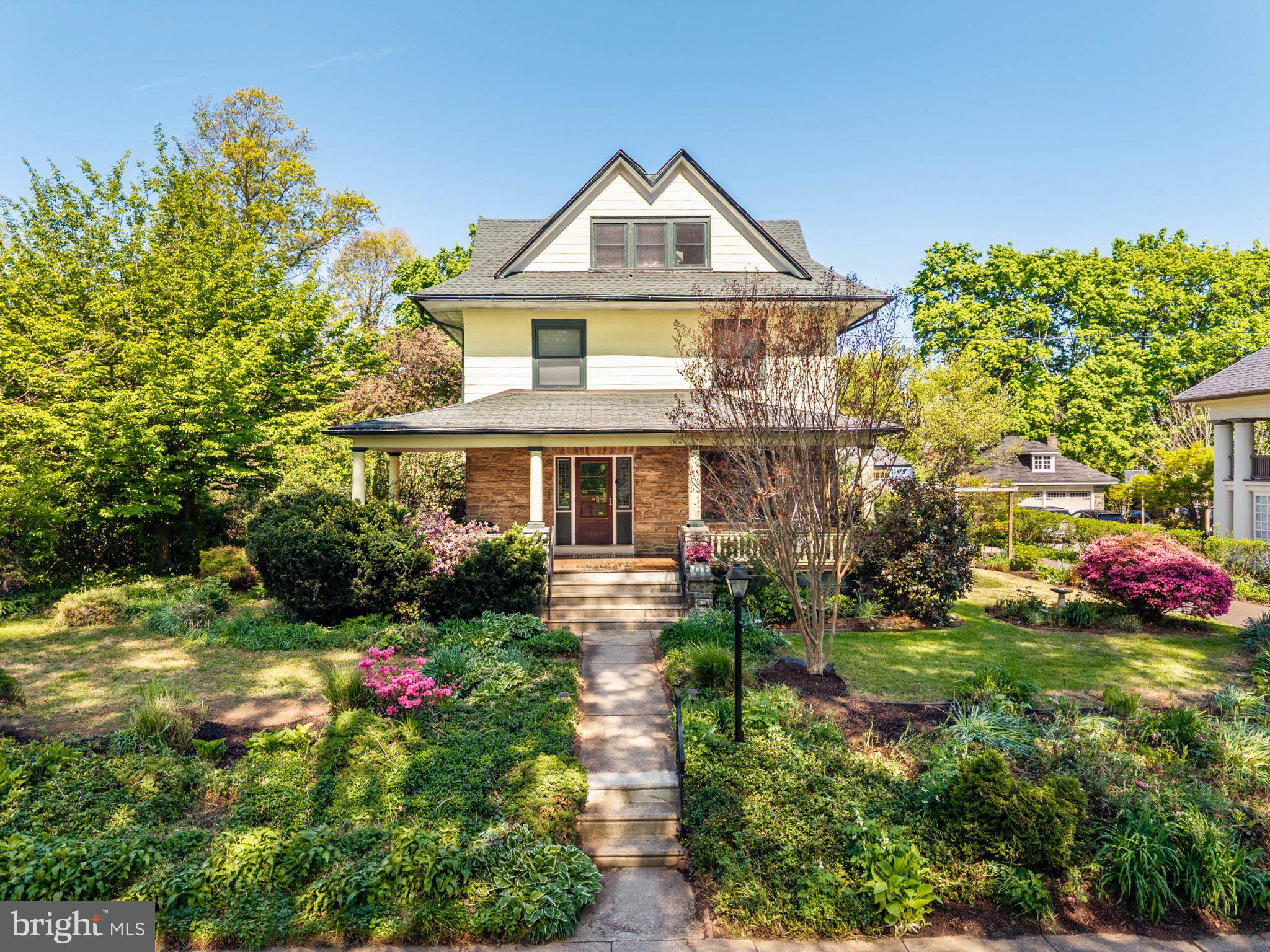 7602 Spring Avenue Elkins Park, PA 19027 - Photo 1 of 50 a front view of a house with a yard and potted plants