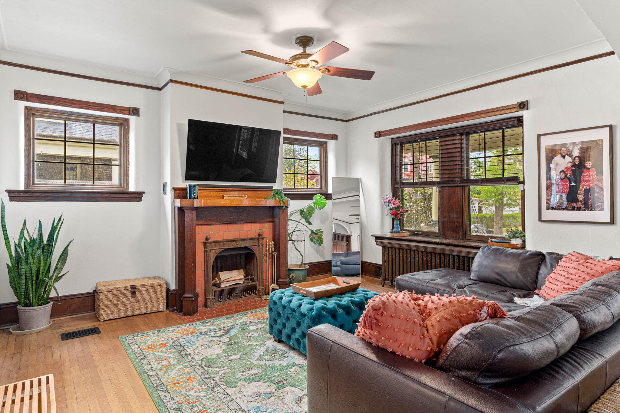 7602 Spring Avenue Elkins Park, PA 19027 - Photo 13 of 50 a living room with furniture a flat screen tv and a fireplace