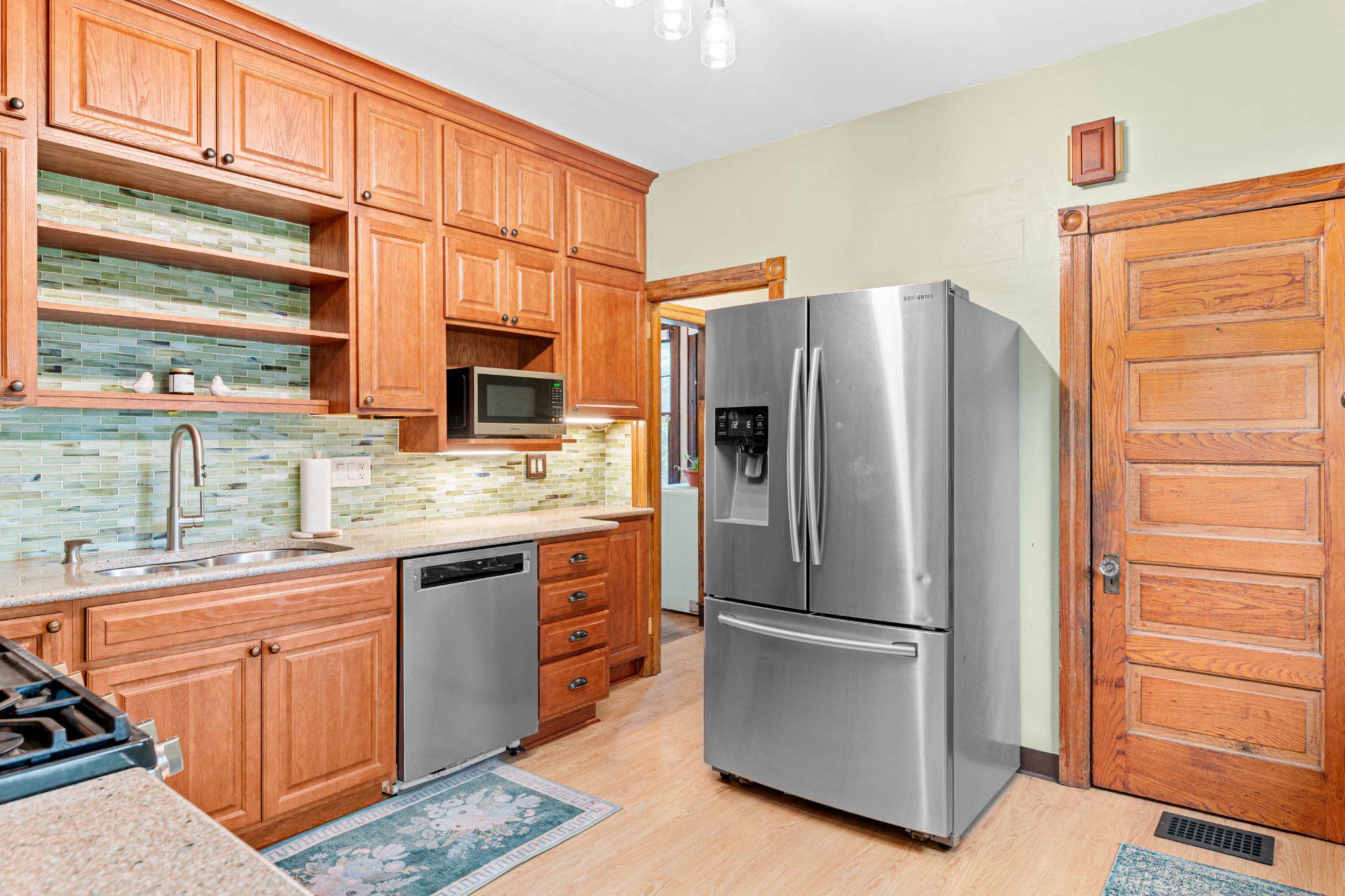 7602 Spring Avenue Elkins Park, PA 19027 - Photo 19 of 50 a kitchen with stainless steel appliances a refrigerator and cabinets