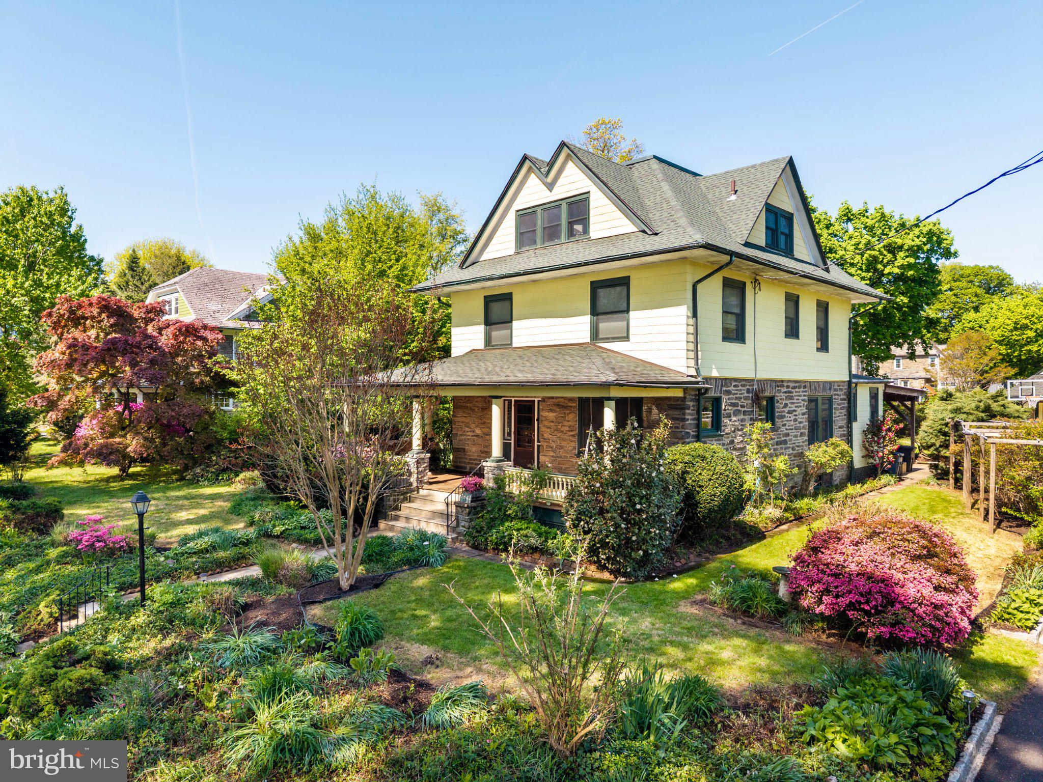7602 Spring Avenue Elkins Park, PA 19027 - Photo 2 of 50 a front view of a house with a yard and fountain in middle