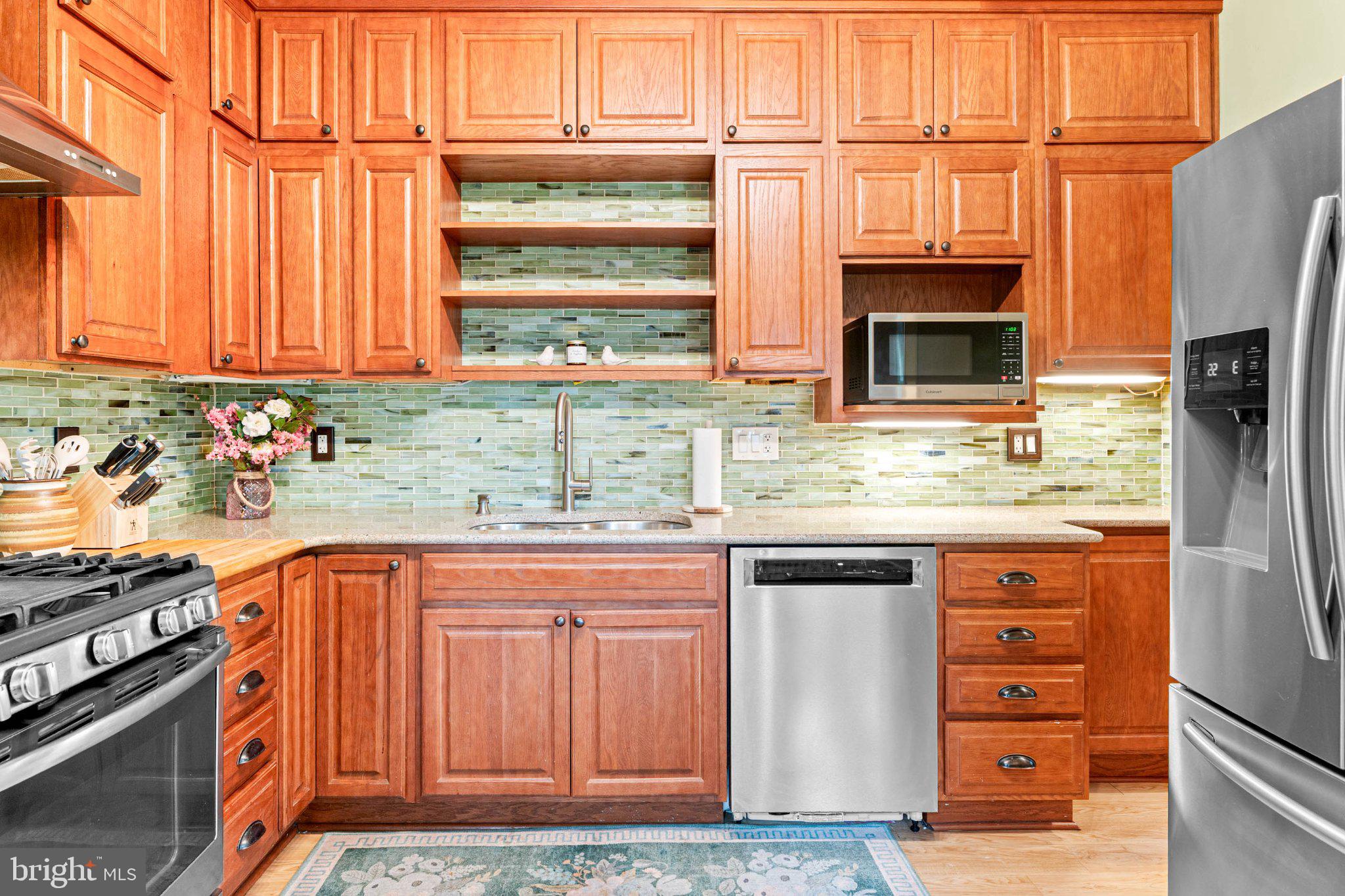 7602 Spring Avenue Elkins Park, PA 19027 - Photo 21 of 50 a kitchen with stainless steel appliances granite countertop a refrigerator and a sink