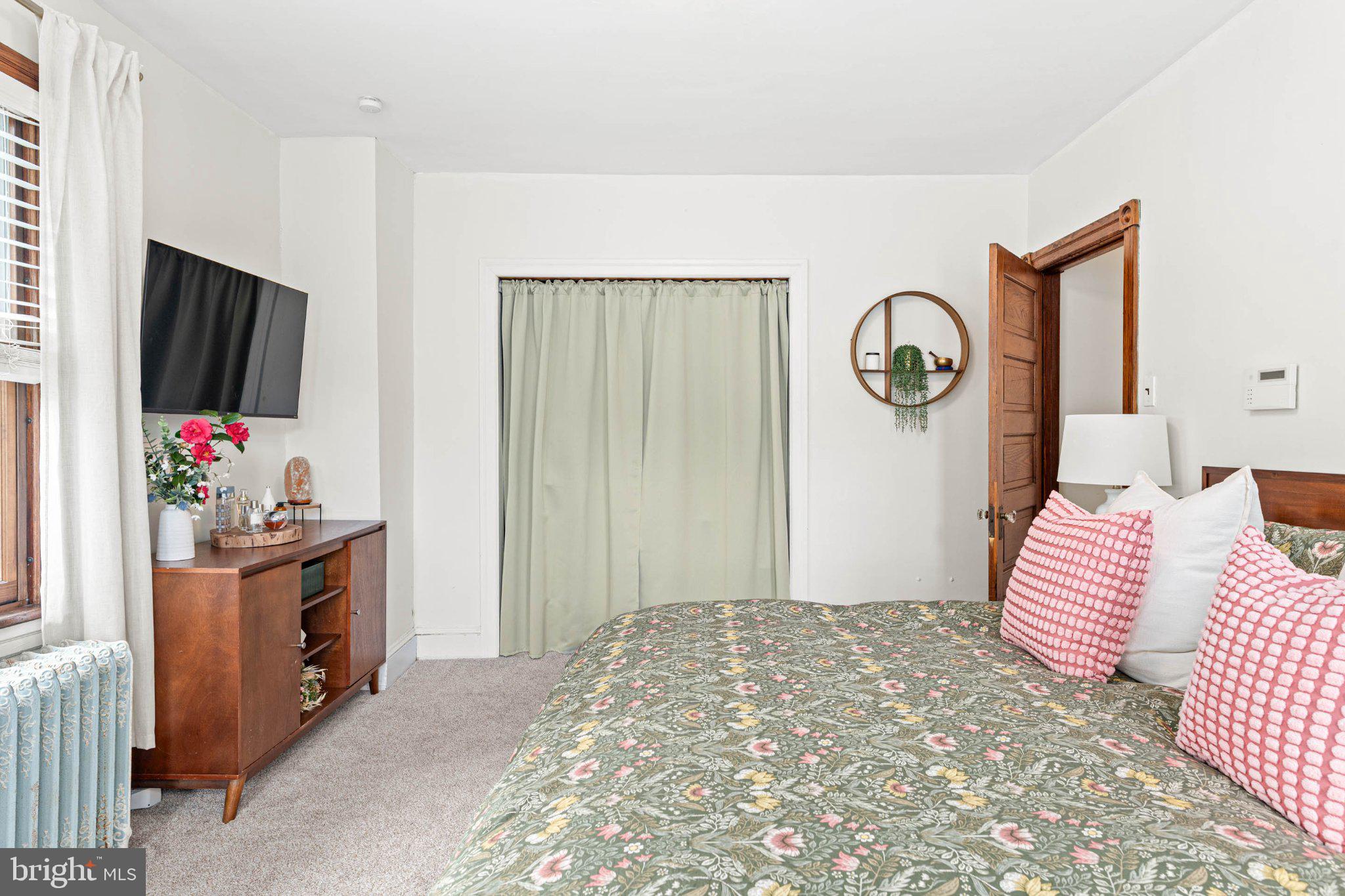 7602 Spring Avenue Elkins Park, PA 19027 - Photo 31 of 50 a bedroom with a bed and a flat screen tv