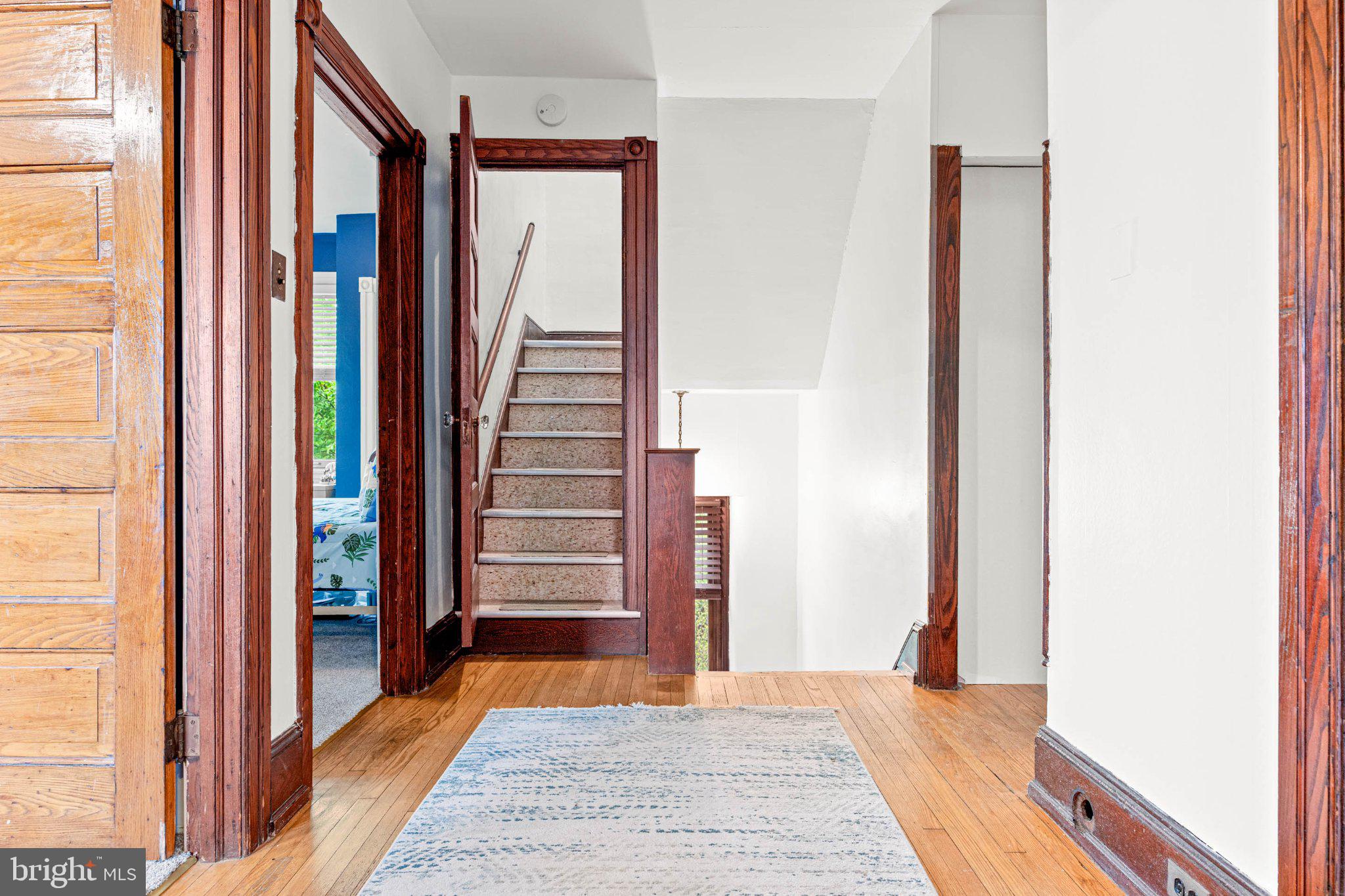 7602 Spring Avenue Elkins Park, PA 19027 - Photo 37 of 50 a view of a hallway with wooden floor and entryway