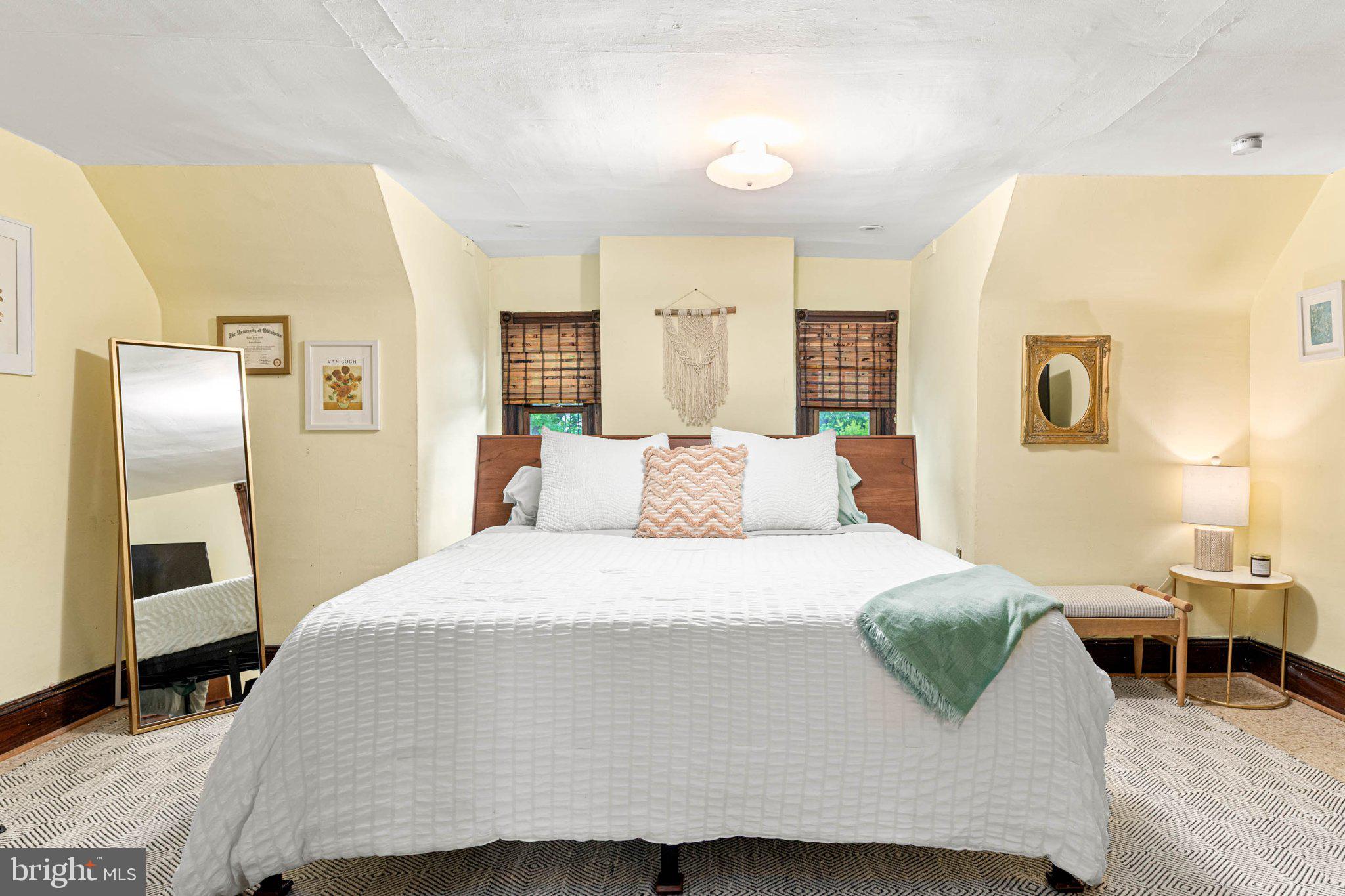 7602 Spring Avenue Elkins Park, PA 19027 - Photo 42 of 50 a large bed sitting in a bedroom next to a window