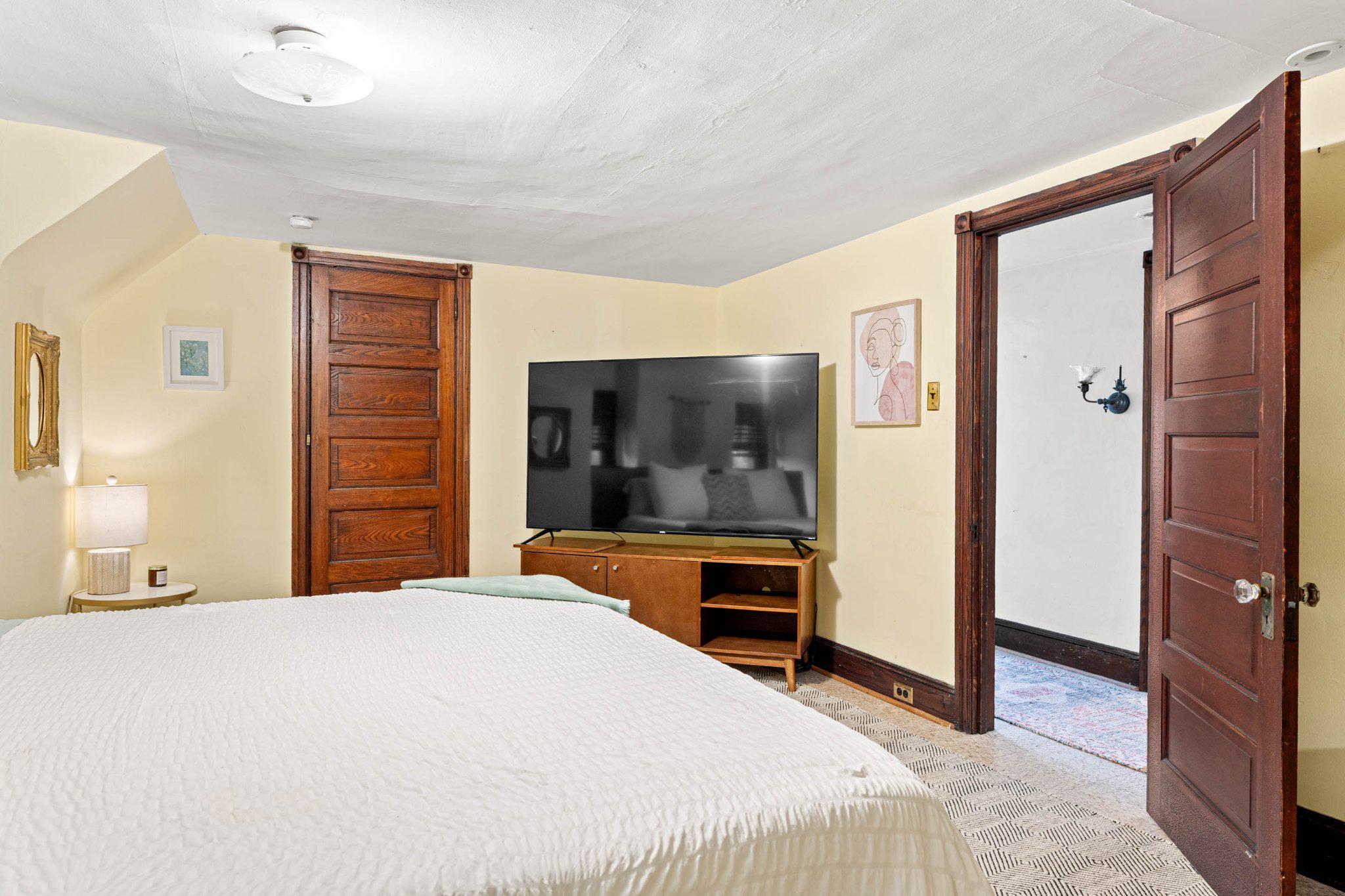 7602 Spring Avenue Elkins Park, PA 19027 - Photo 43 of 50 a bedroom with a large bed and a dresser