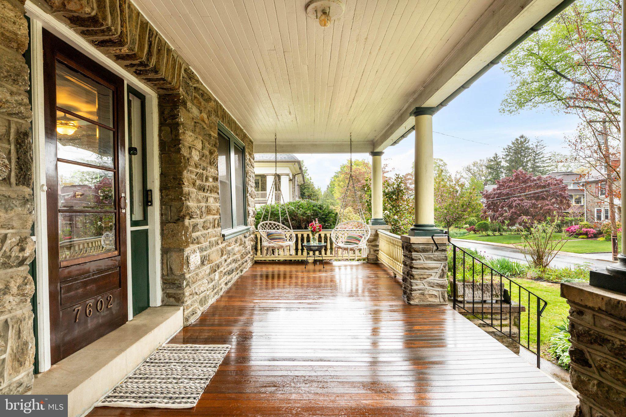 7602 Spring Avenue Elkins Park, PA 19027 - Photo 5 of 50 a view of a patio with couches potted plants and wooden floor