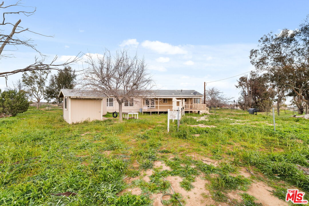 6425 Smoke Tree Road Phelan, CA 92371 - Photo 27 of 35 a view of a house with a big yard