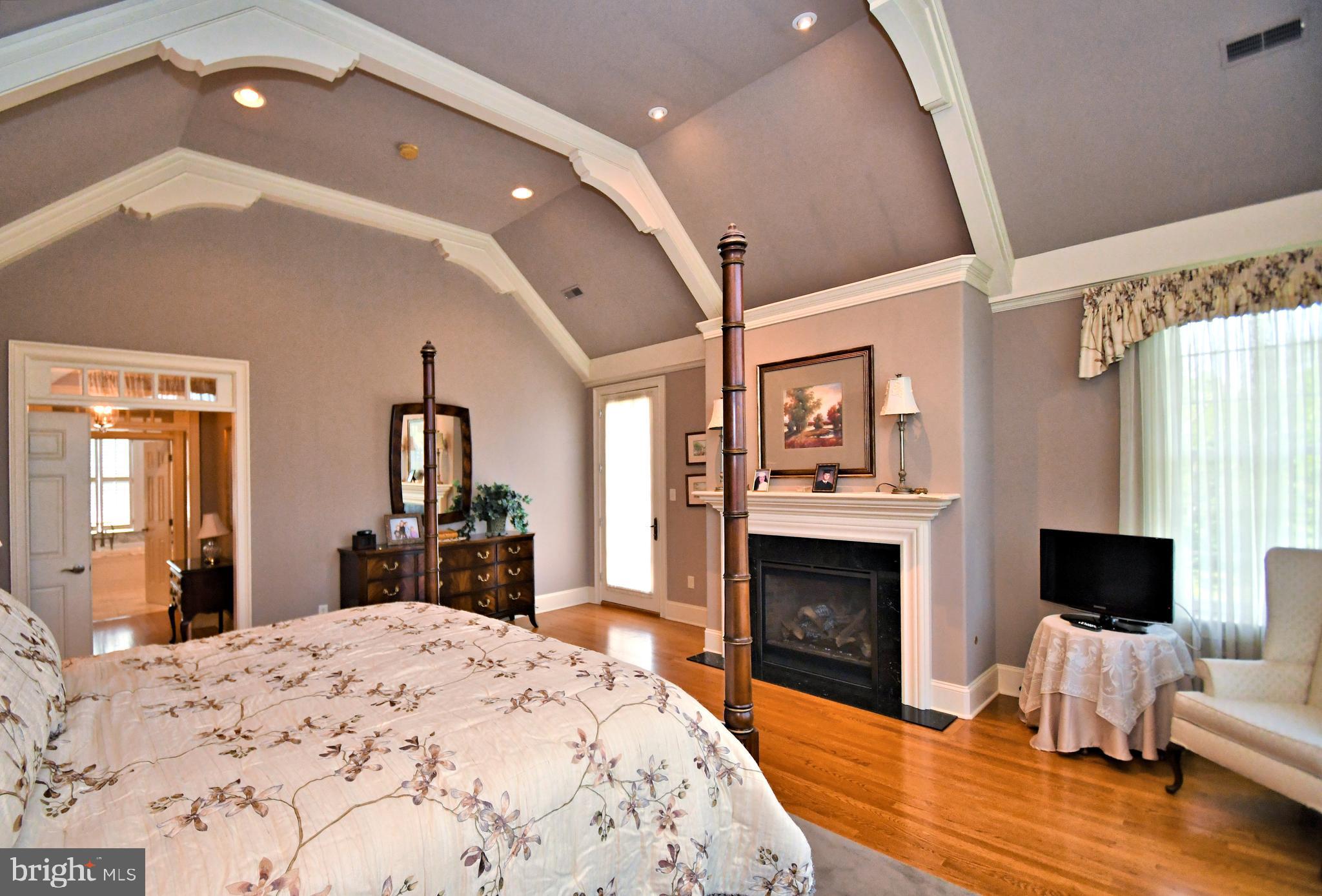 1811 Hollow Road Lansdale, PA 19446 - Photo 49 of 130 a spacious bedroom with a large bed and a fireplace
