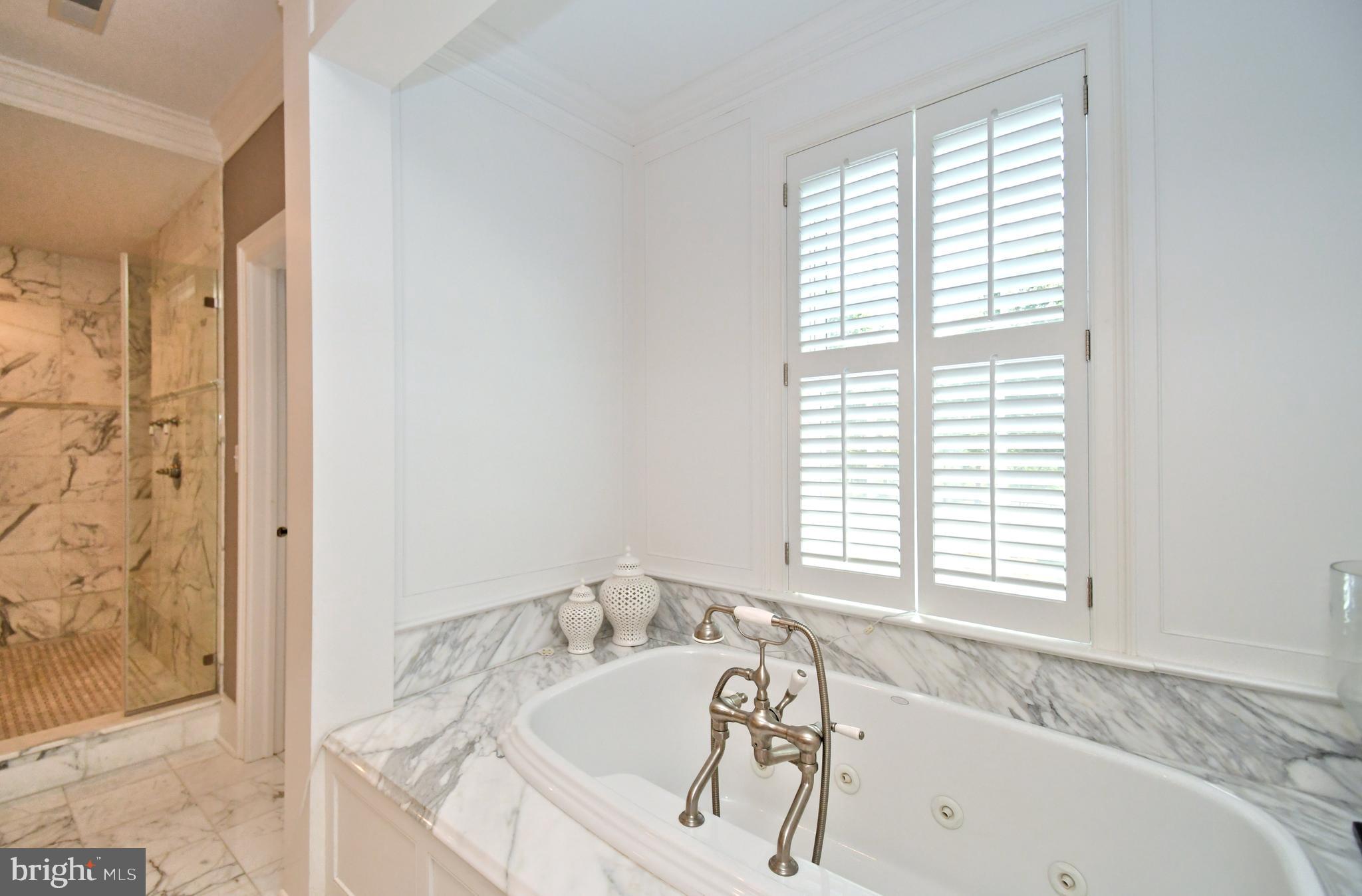 1811 Hollow Road Lansdale, PA 19446 - Photo 53 of 130 a bath tub sitting in a bathroom next to a window