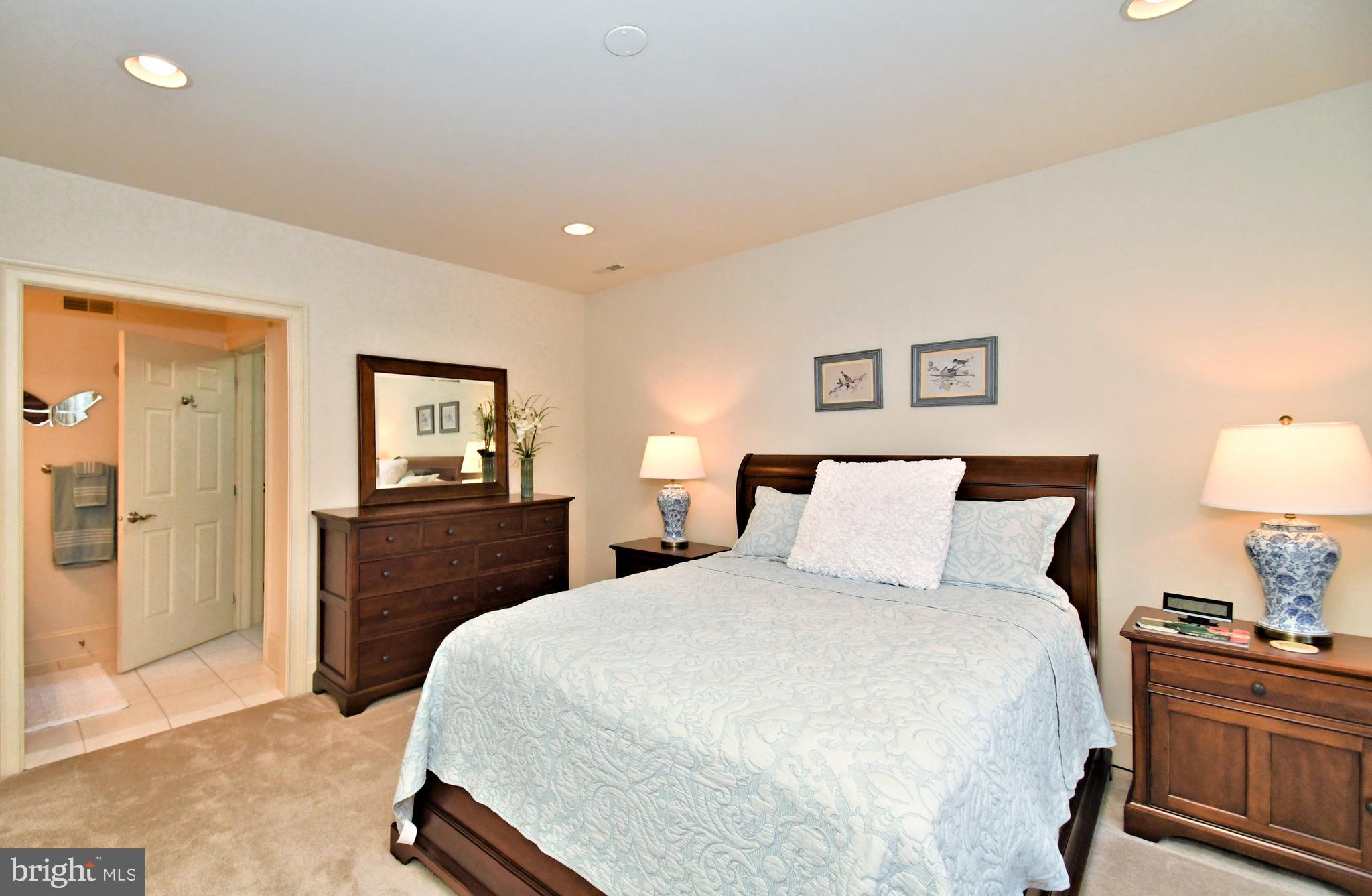 1811 Hollow Road Lansdale, PA 19446 - Photo 72 of 130 a bedroom with a bed and a lamp on dresser