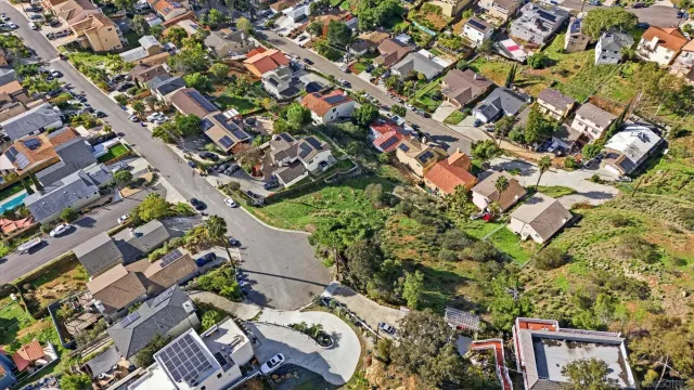 an aerial view of residential houses with outdoor space