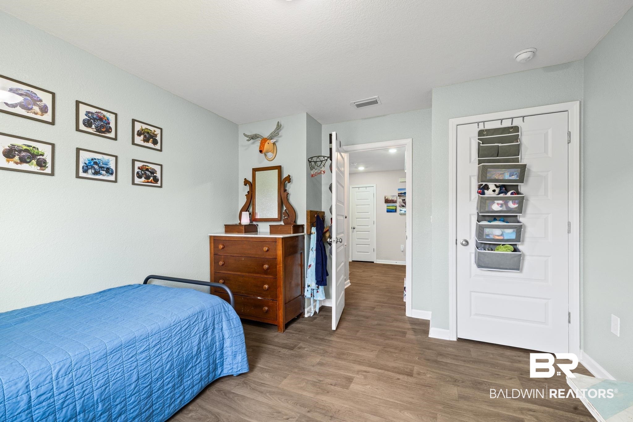 3078 Camino Real Loop Lillian, AL 36549 - Photo 16 of 51 Bedroom with wood finished floors and baseboards