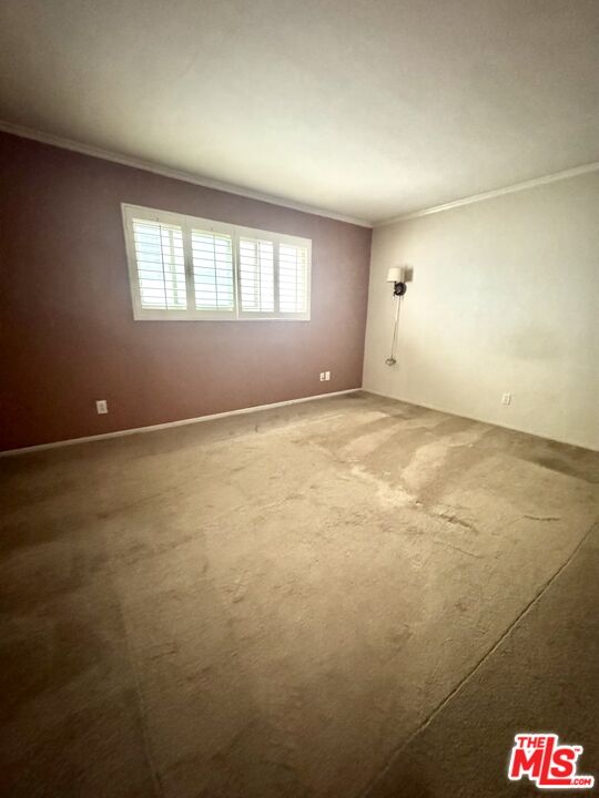 12030 Rochester Avenue, Unit 207 Los Angeles, CA 90025 - Photo 11 of 12 en empty room with windows and closet