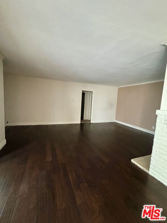 12030 Rochester Avenue, Unit 207 Los Angeles, CA 90025 - Photo 5 of 12 a view of room with window and wooden floor