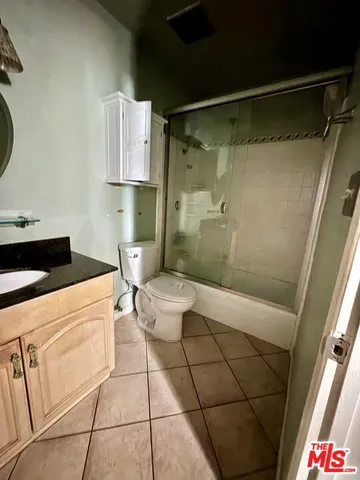 a bathroom with a toilet a sink and shower