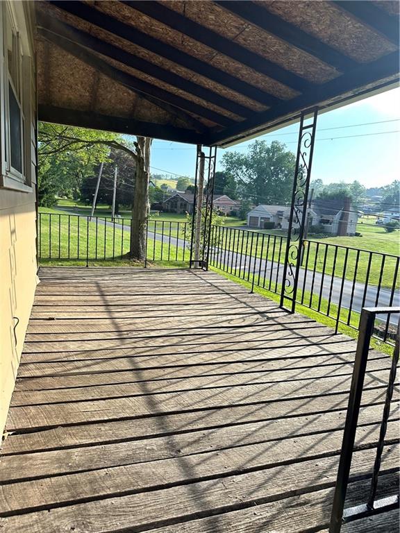 611 Mercer Road Beaver Falls, PA 15010 - Photo 27 of 32 a view of a balcony with a floor to ceiling window and wooden floor