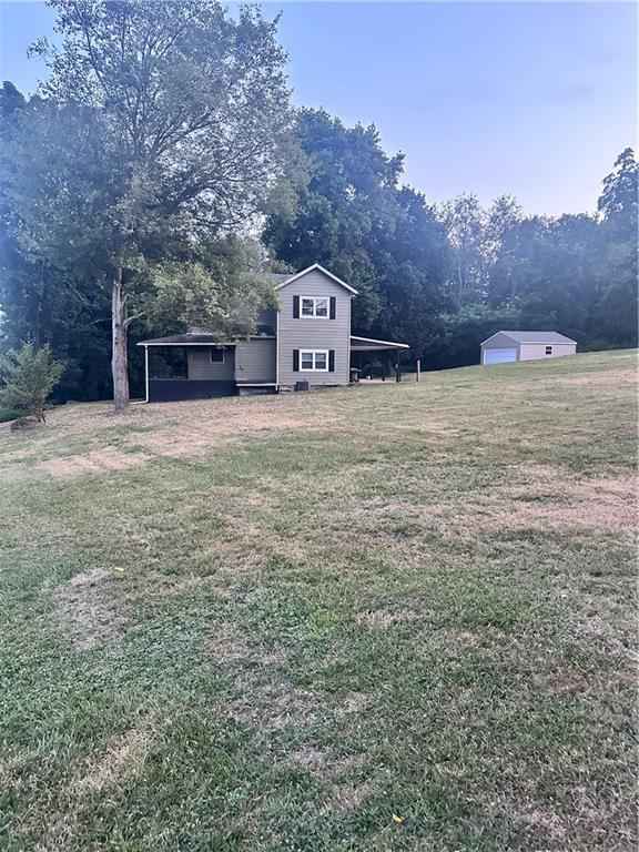 611 Mercer Road Beaver Falls, PA 15010 - Photo 31 of 32 a large tree in the middle of a field