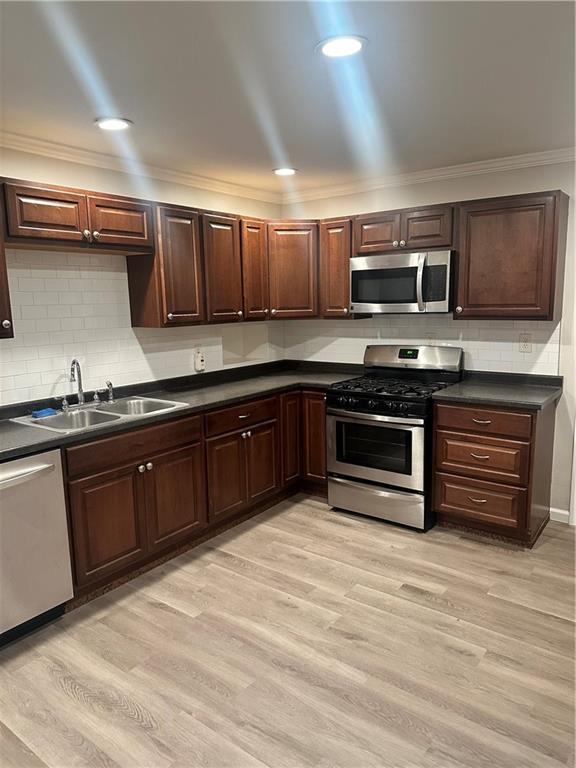 611 Mercer Road Beaver Falls, PA 15010 - Photo 5 of 32 a kitchen with stainless steel appliances granite countertop a stove and a sink