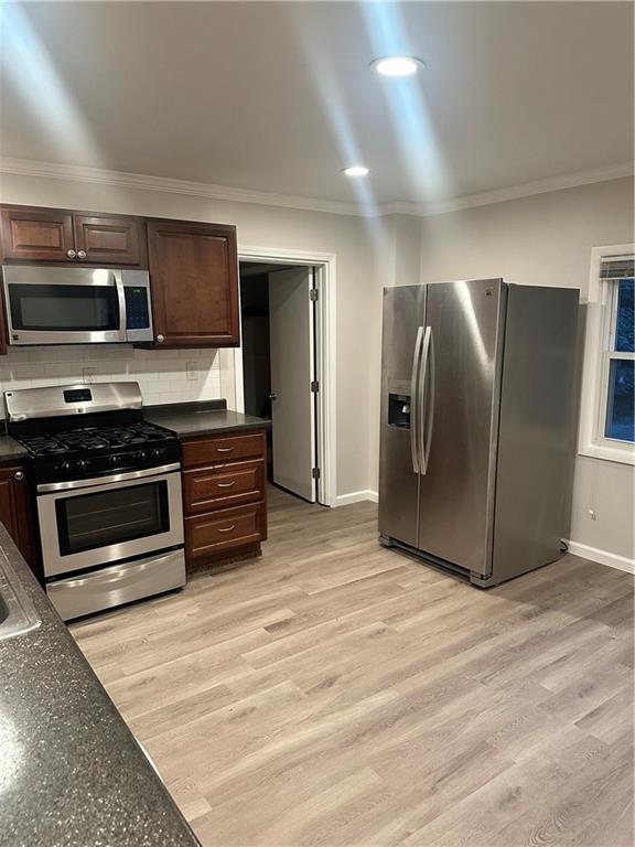 611 Mercer Road Beaver Falls, PA 15010 - Photo 6 of 32 a kitchen with stainless steel appliances a stove and a refrigerator