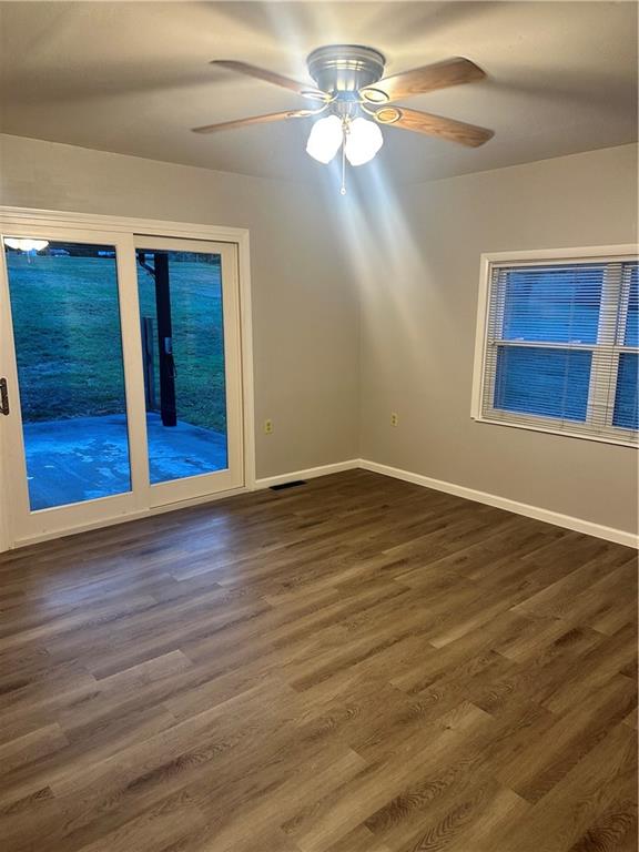 611 Mercer Road Beaver Falls, PA 15010 - Photo 10 of 32 a view of an empty room with wooden floor closet and a chandelier fan