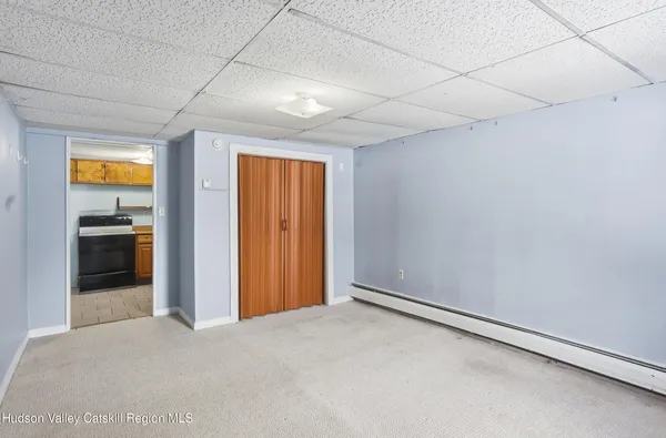 a bathroom with a sink mirror and toilet