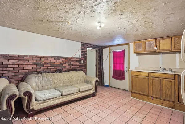 a bathroom with a sink a toilet and shower curtain