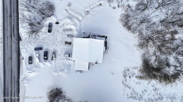 a view of kitchen with furniture and refrigerator