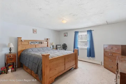 a wooden bench sitting in the middle of a snow