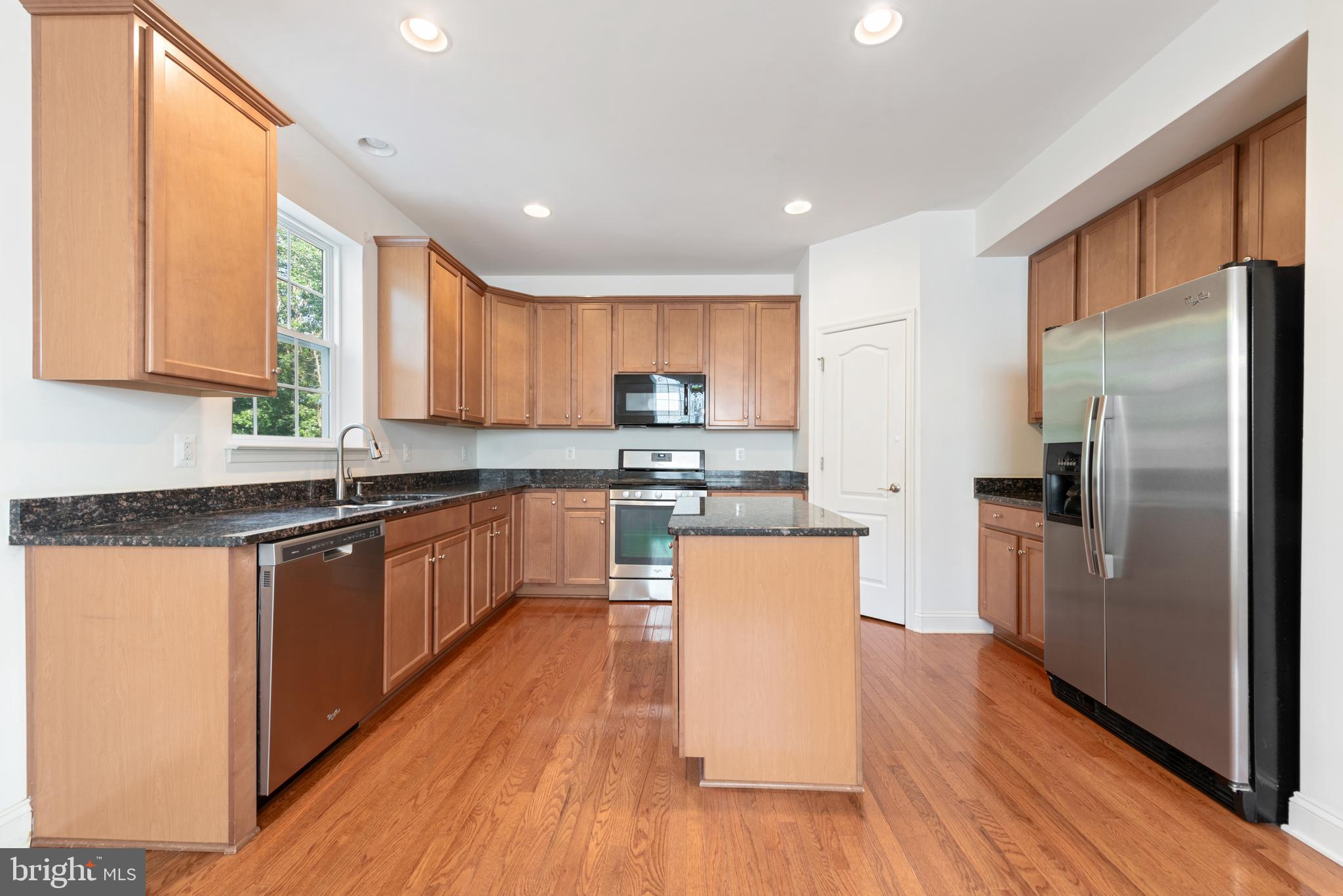 42247 Castle Ridge Square Brambleton, VA 20148 - Photo 11 of 34 Wood floor in the kitchen