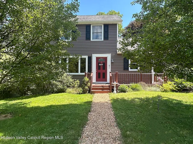 a view of garden with trees in the background