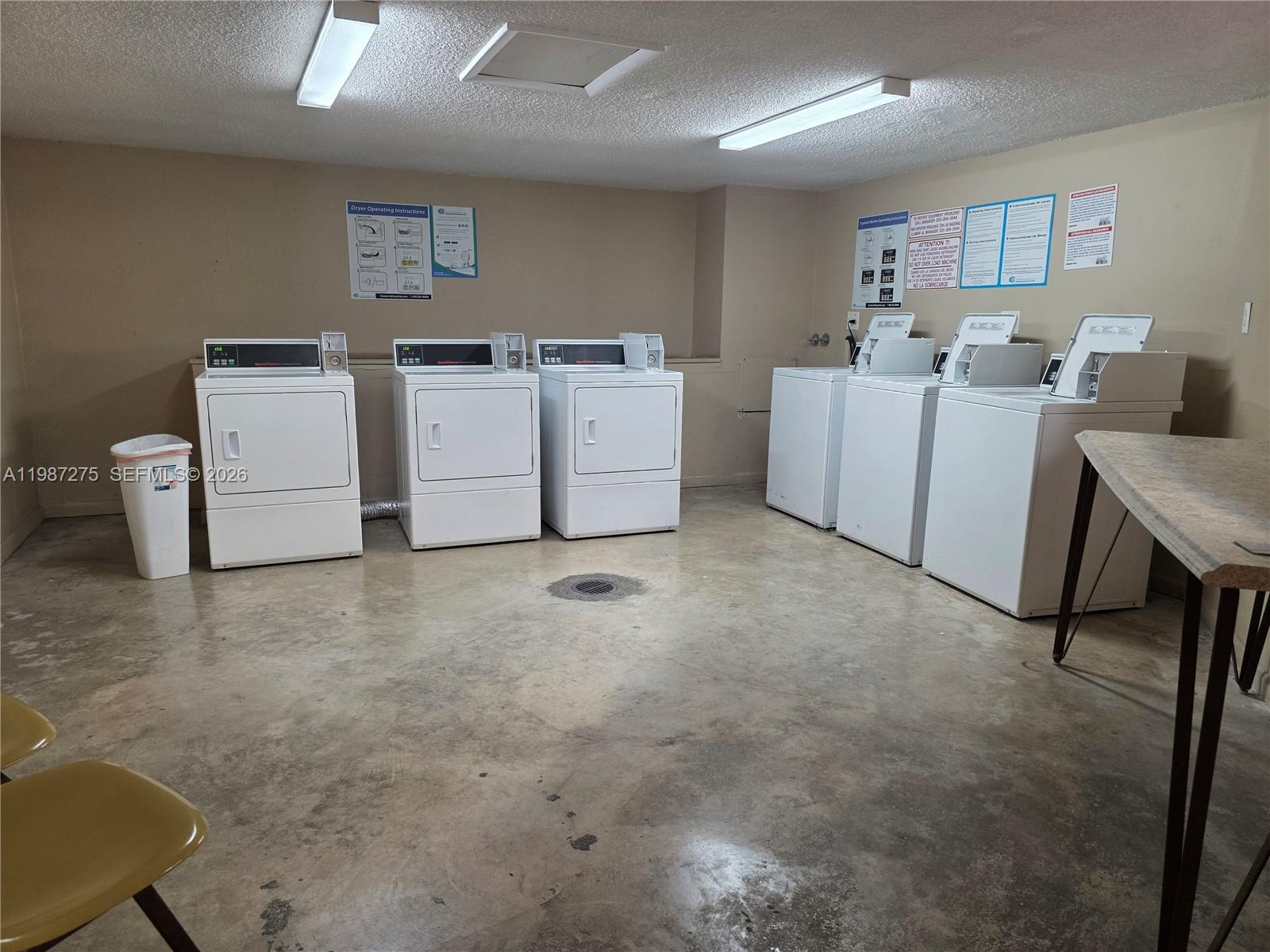 8615 Northwest 8th Street, Unit 319 Miami, FL 33126 - Photo 11 of 19 a utility room with dryer and washer