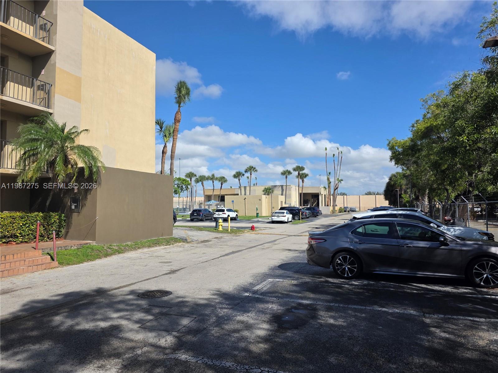 8615 Northwest 8th Street, Unit 319 Miami, FL 33126 - Photo 12 of 19 a view of a street with cars