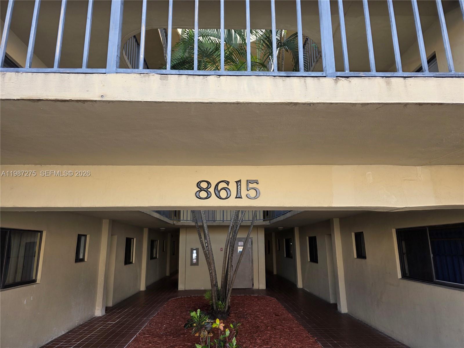 8615 Northwest 8th Street, Unit 319 Miami, FL 33126 - Photo 3 of 19 a view of a house with entryway
