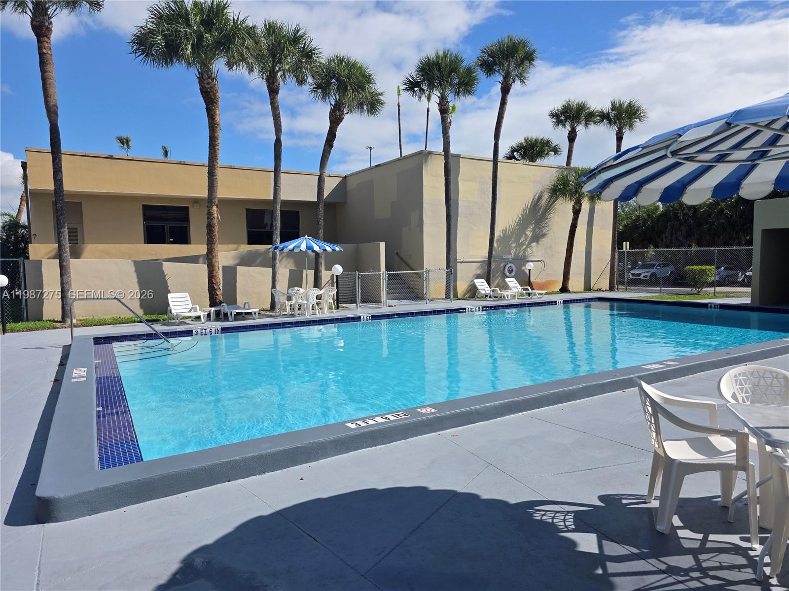 8615 Northwest 8th Street, Unit 319 Miami, FL 33126 - Photo 6 of 19 a view of outdoor space with seating area