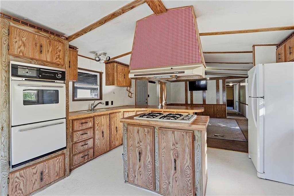 1300 Hidden Valley Road Bulger, PA 15019 - Photo 17 of 25 a kitchen with stainless steel appliances granite countertop a stove and a refrigerator